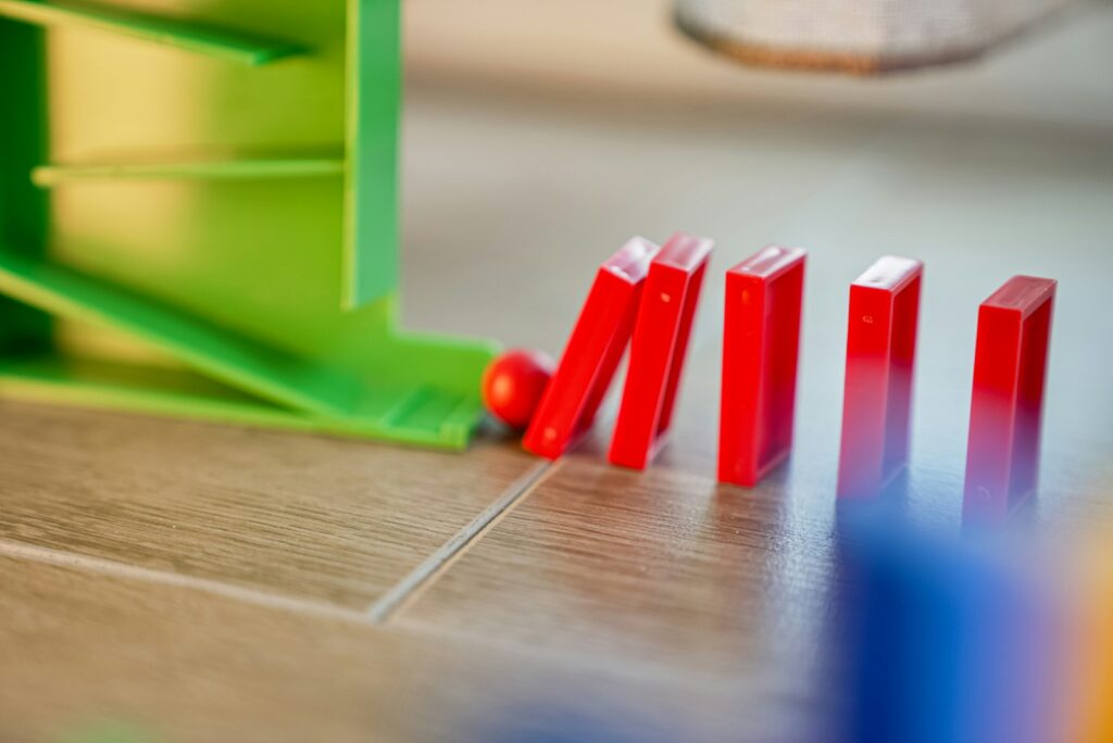 A close up of a game of dominos on a table