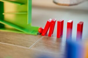 A close up of a game of dominos on a table