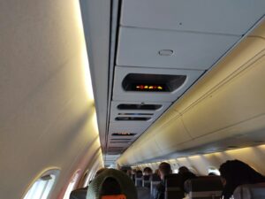 a group of people sitting on an airplane